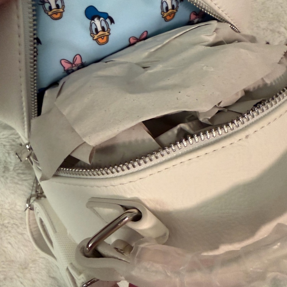 Reversible Donald & Daisy Loungefly backpack/crossbody. - Picture 9 of 13